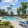 Community pool with reclining seats and lush landscaping at Stone Canyon