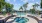 Jacuzzi and pool with ample seating and modern landscaping at Stone Canyon