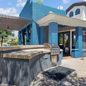 Outdoor community grilling station at Stone Canyon 