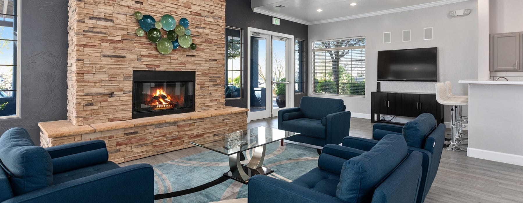lounge area with seating and a fireplace